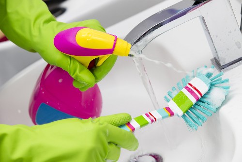 Professional cleaners handling kitchen and bathroom cleaning in N5